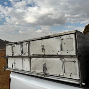 LOT 1: Frame is alliminium. Frame alone cost R25 000 to get made.  4 baskets on each side.  Each basket takes 25-30 pigeons.  Fits on a double cab or club cab.